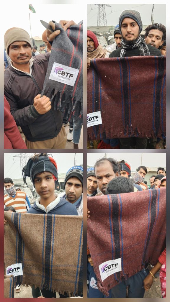 People holding blankets received from CBTF Foundation during a community support initiative 4