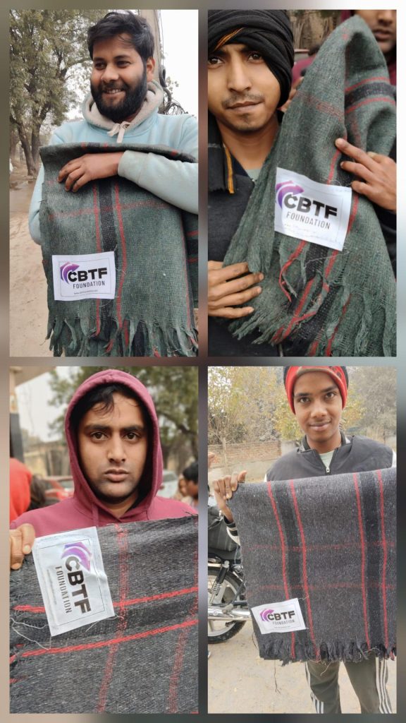 People holding blankets received from CBTF Foundation during a community support initiative 1